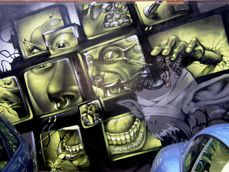 graffiti mural with faces