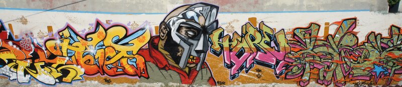 graffiti mural with stylized face