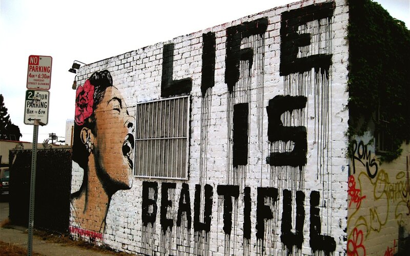 graffiti mural with woman and text