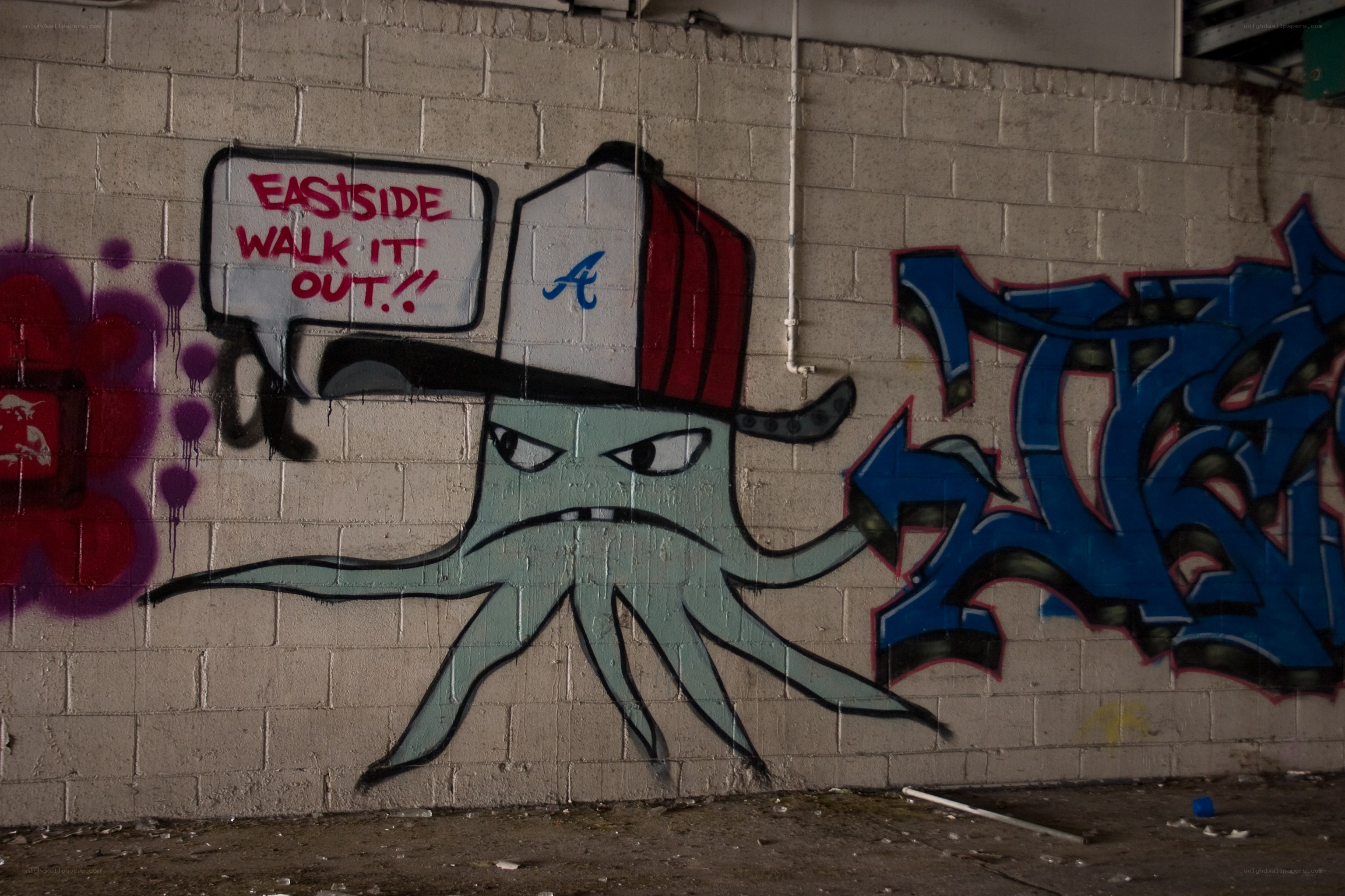 Graffiti octopus on brick wall