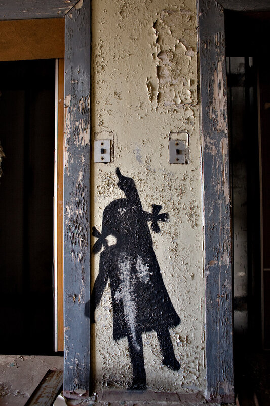 graffiti of a child on a wall