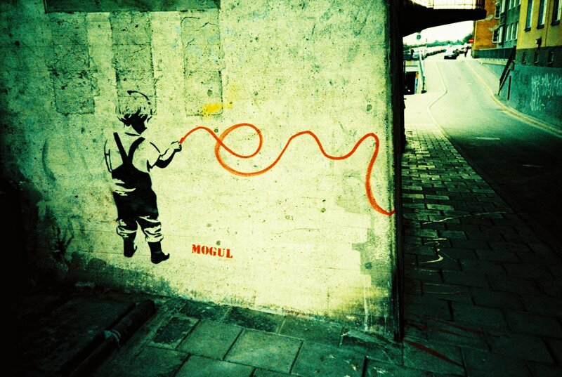 Graffiti of a child with a hose