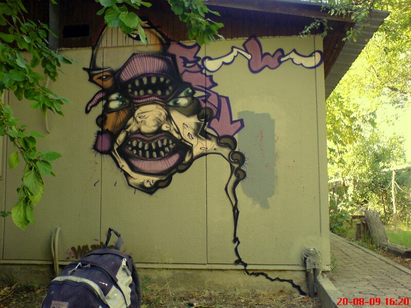 graffiti of a monster on a wall