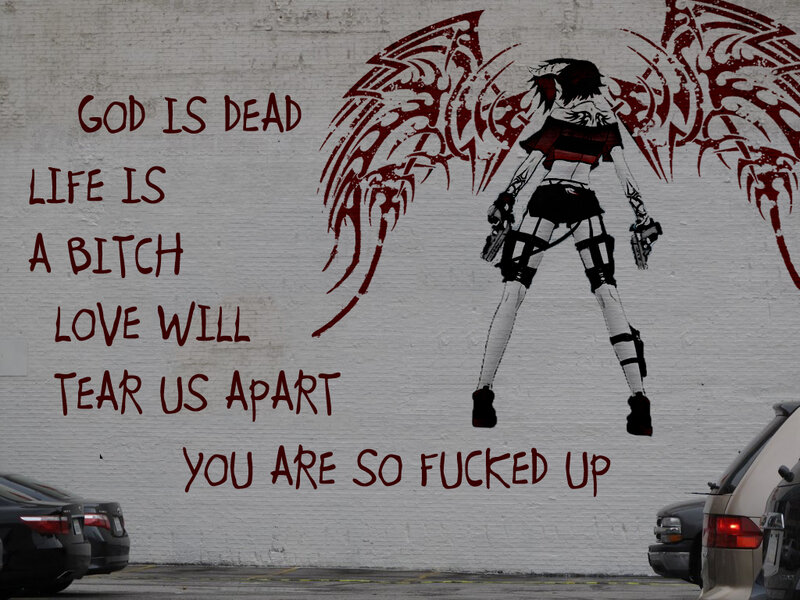 graffiti of angel with guns