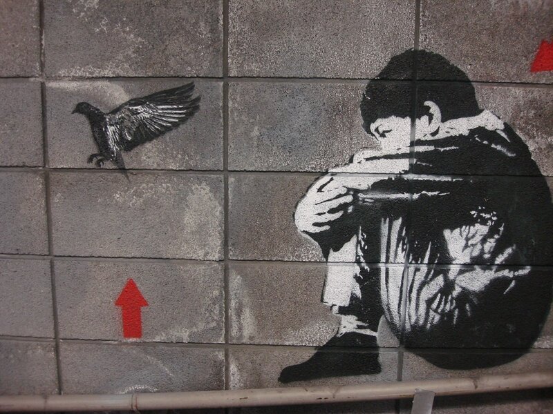 graffiti of boy with bird