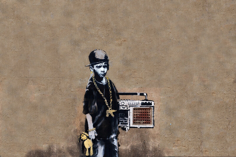 graffiti of boy with boombox