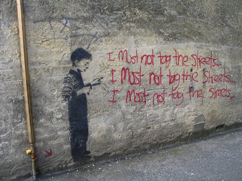 graffiti of boy with spray can