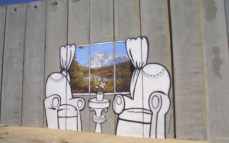 Graffiti of chairs with mountain view