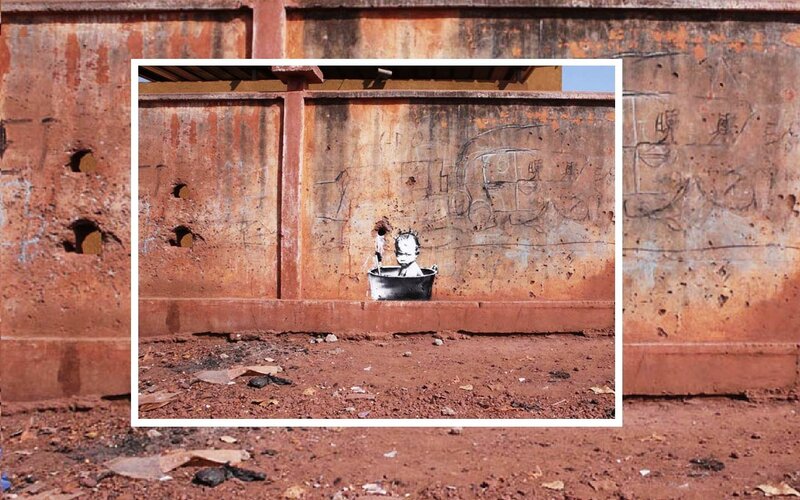 graffiti of child in tub