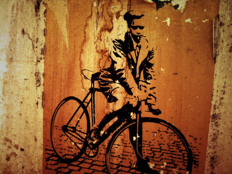 graffiti of cyclist on wall