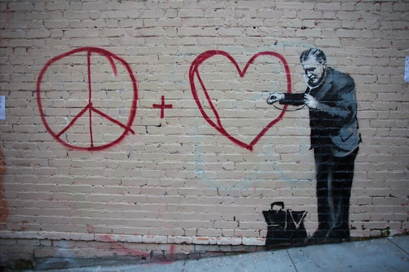 graffiti of doctor with peace and love symbols