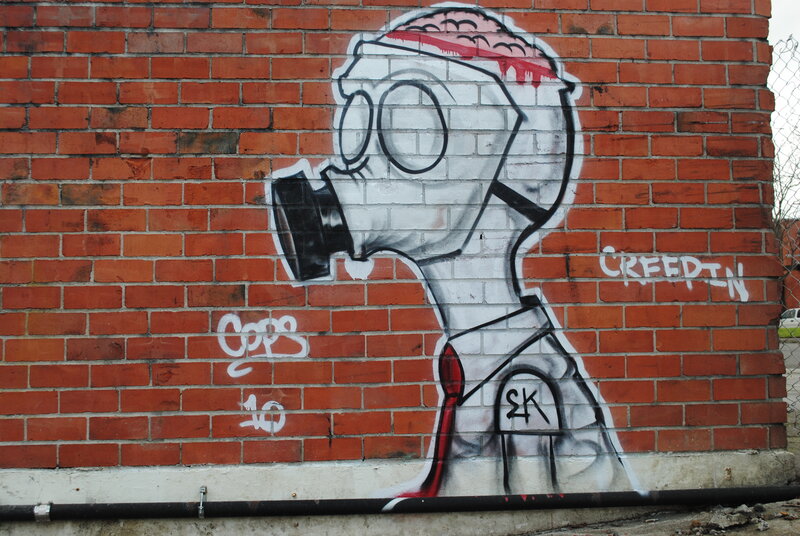 graffiti of gas-masked figure