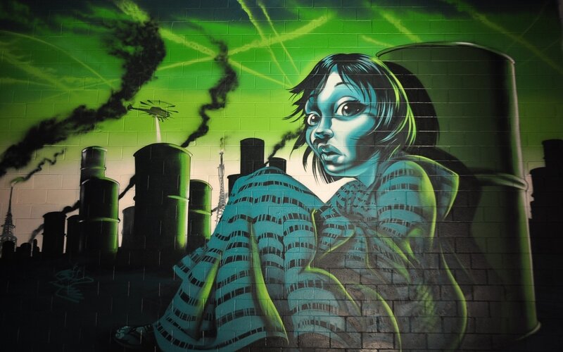 graffiti of girl in industrial city