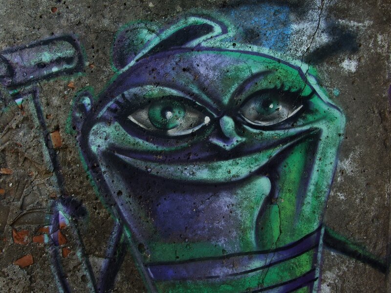 graffiti of green alien face