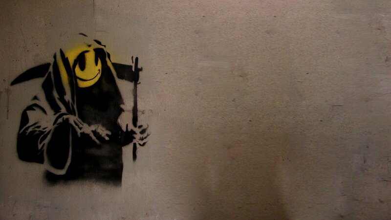 graffiti of grim reaper with smiley face