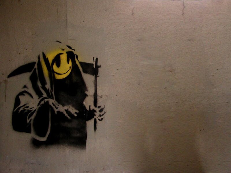 graffiti of grim reaper with smiley face