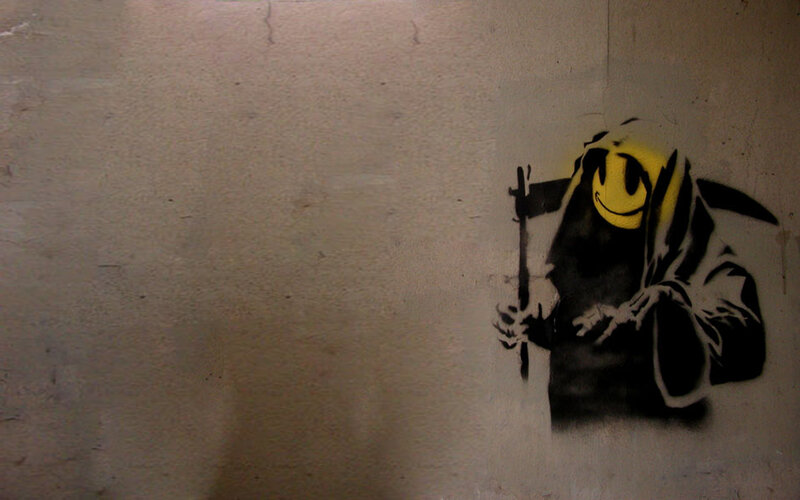 graffiti of grim reaper with smiley face