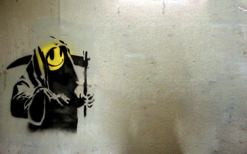 graffiti of grim reaper with smiley face
