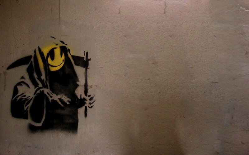 graffiti of grim reaper with smiley face