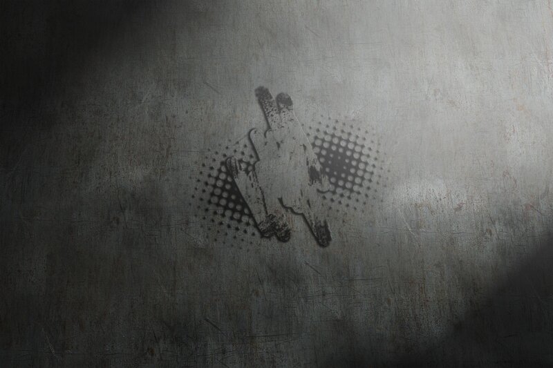graffiti of gun on metal wall
