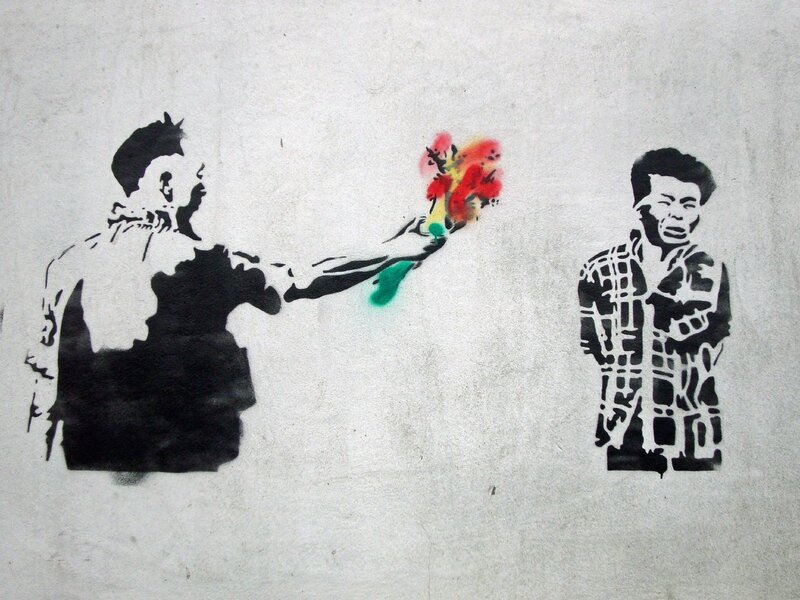 graffiti of man offering flowers
