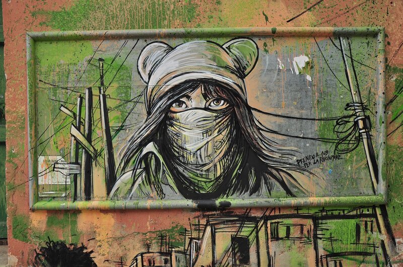graffiti of masked figure