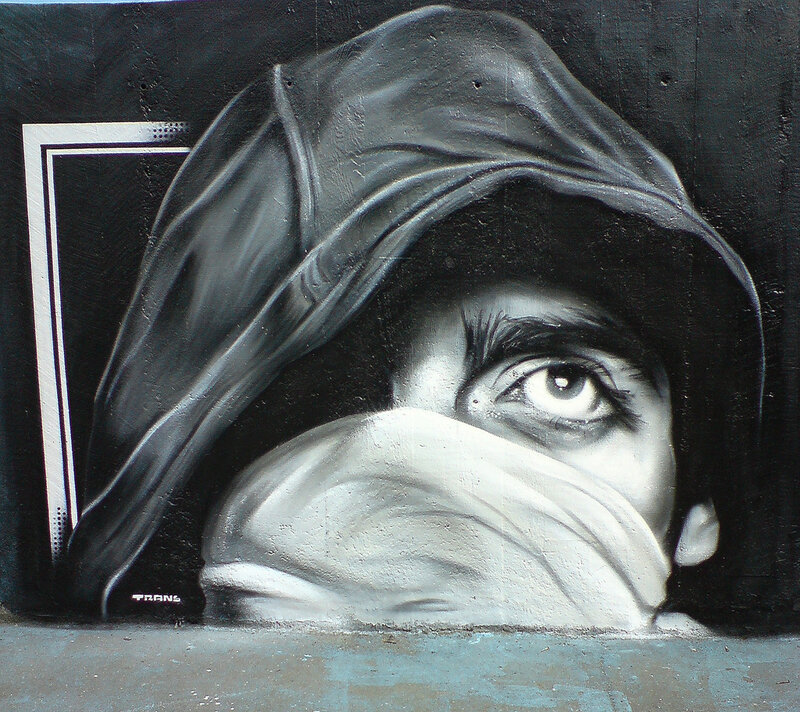 graffiti of masked figure