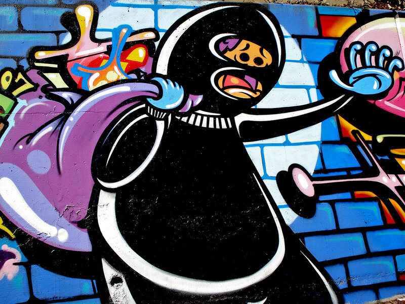 graffiti of masked figure