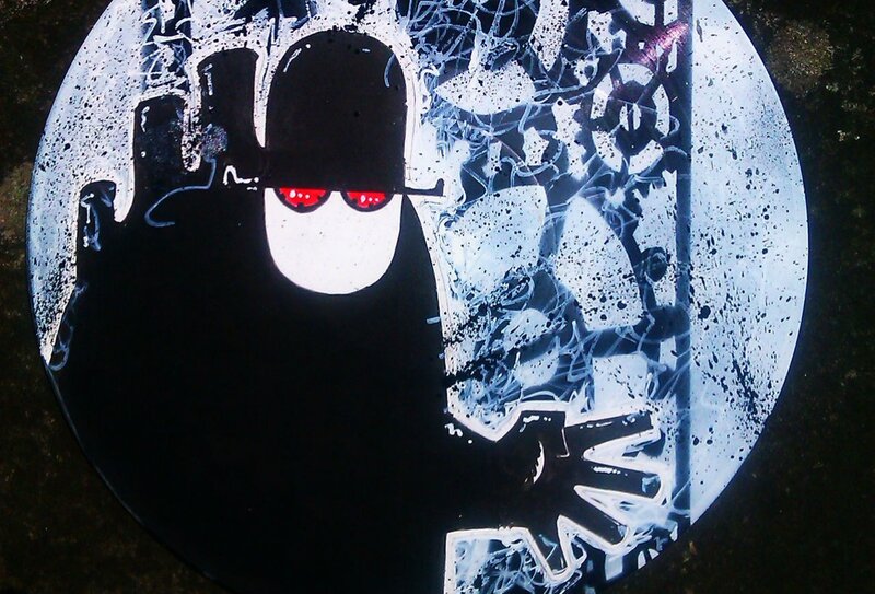 graffiti of masked figure