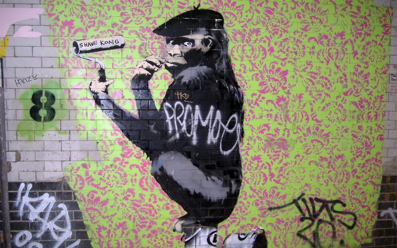 Graffiti of monkey painting wall