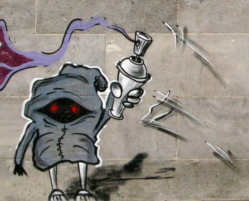 graffiti of monster with spray can