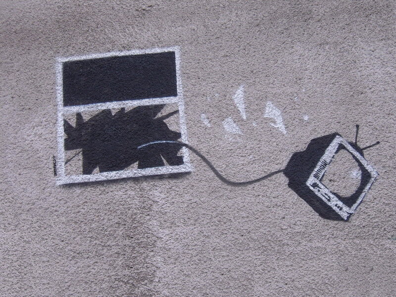graffiti of TV breaking window