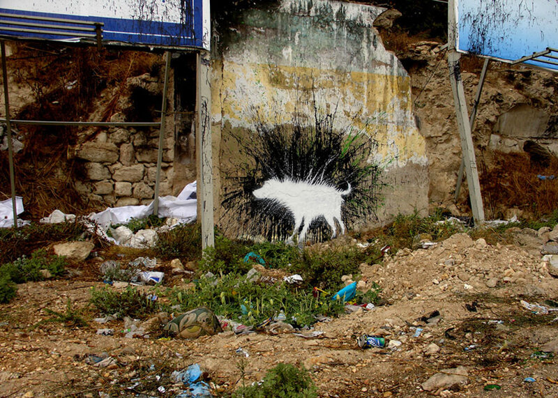 graffiti of white dog on wall
