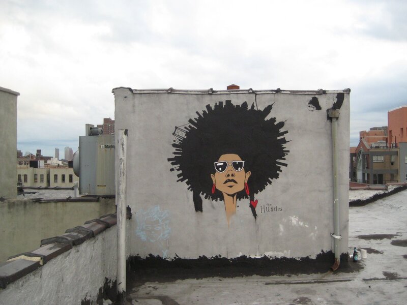 graffiti of woman on rooftop