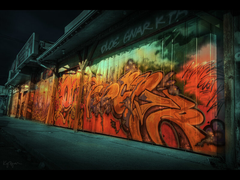 graffiti on a city street at night