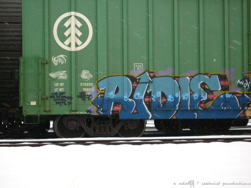 graffiti on a green train car