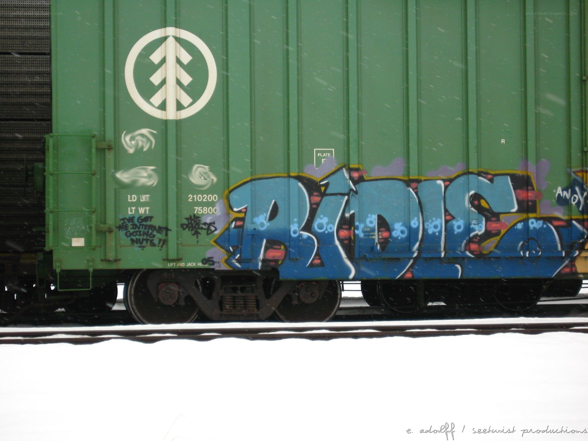graffiti on a green train car