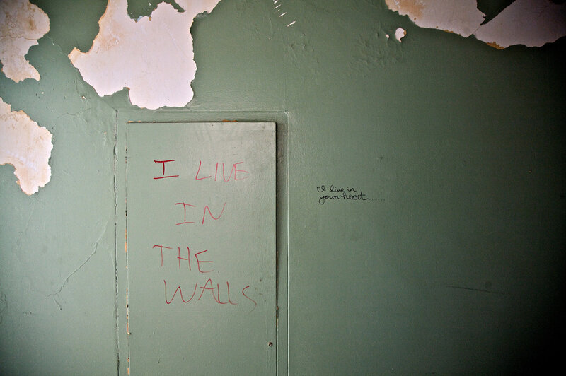 graffiti on a green wall