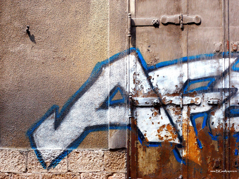 graffiti on a rusty door