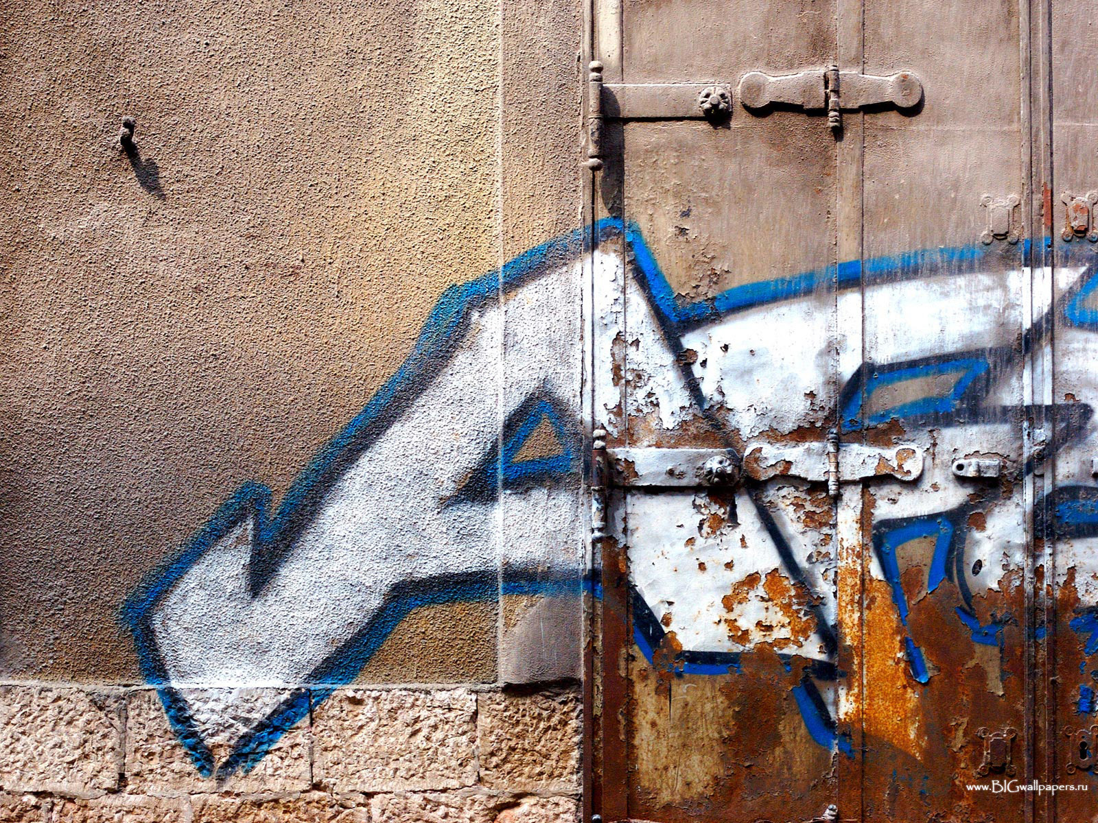 graffiti on a rusty door