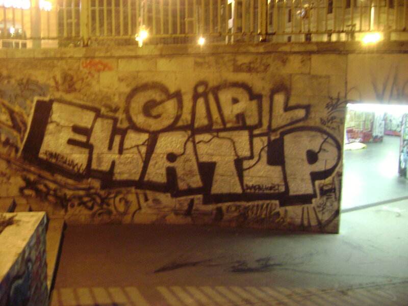 graffiti on a wall at night