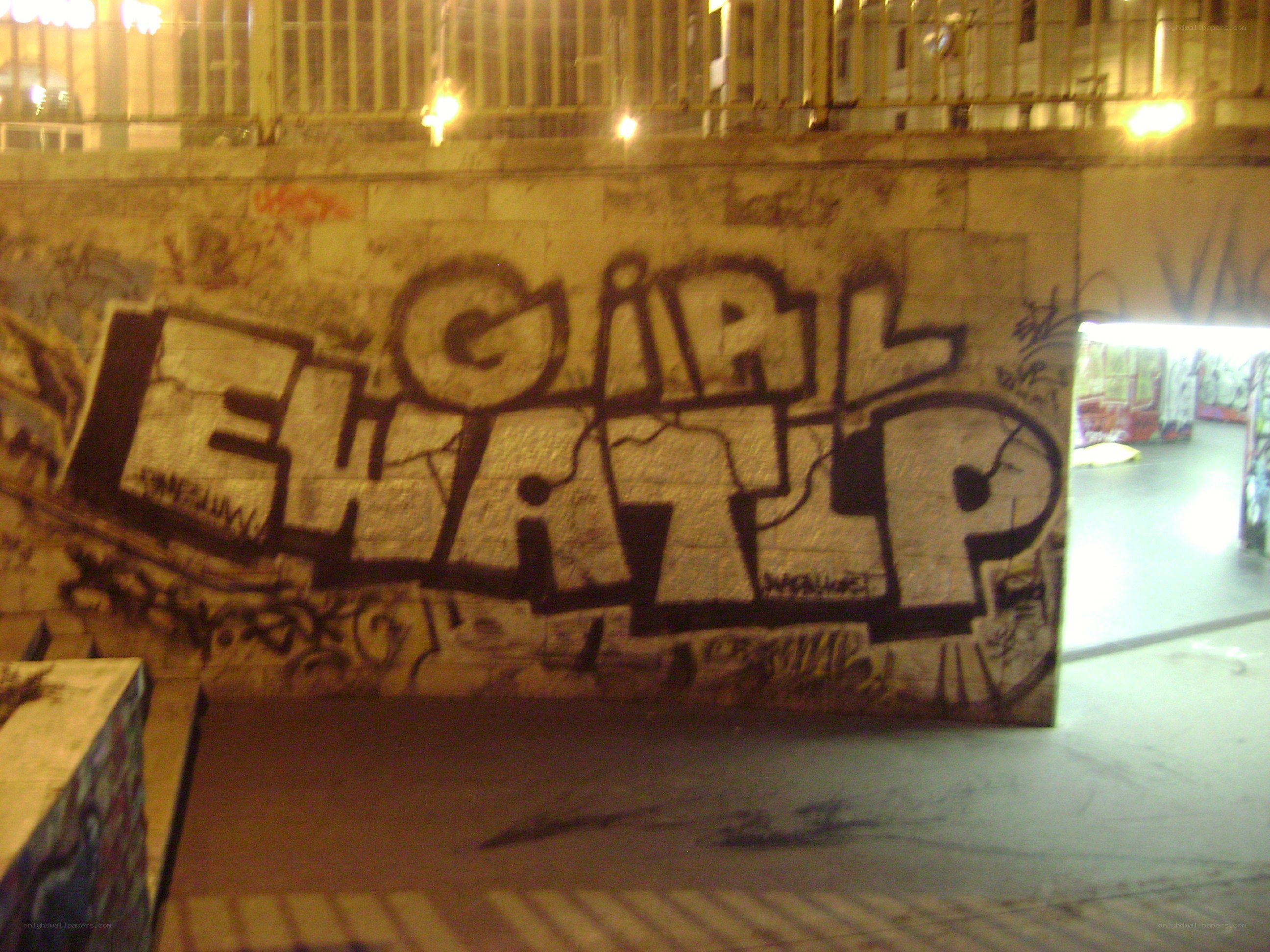 graffiti on a wall at night