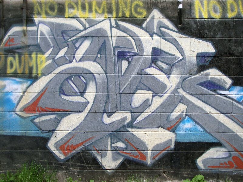 Graffiti on Brick Wall — Gray
