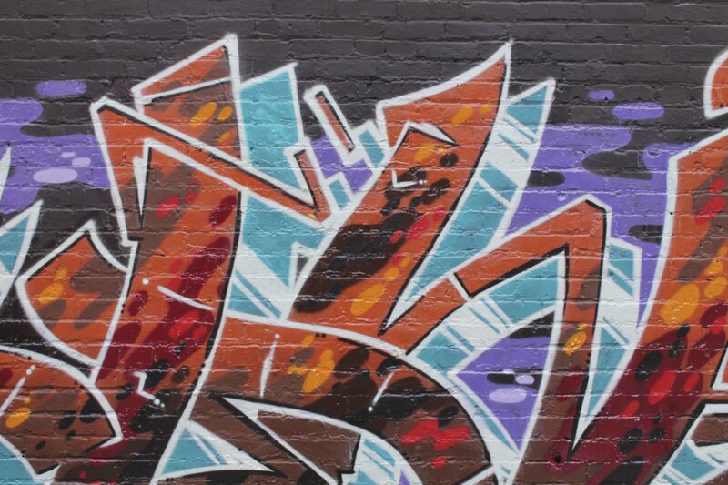 Graffiti on Brick Wall — Orange