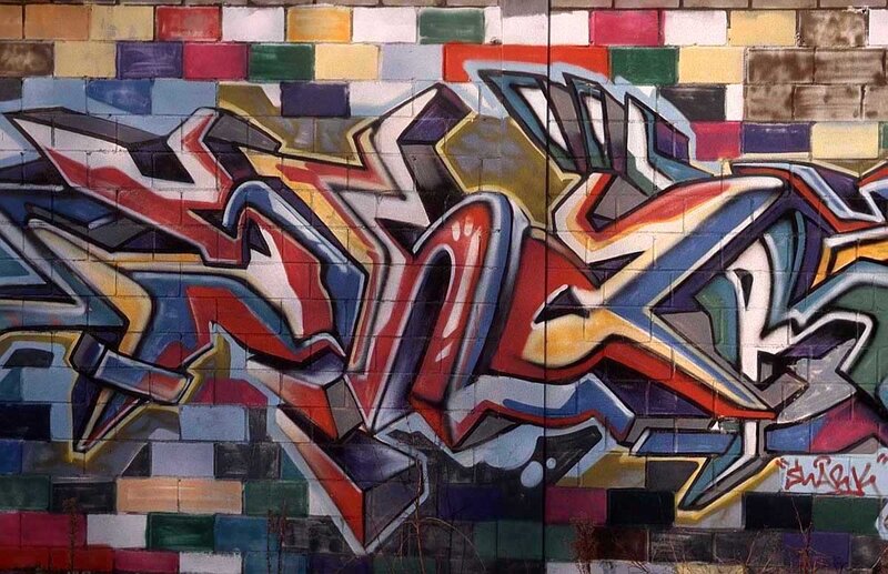 Graffiti on Brick Wall — Red, Vibrant