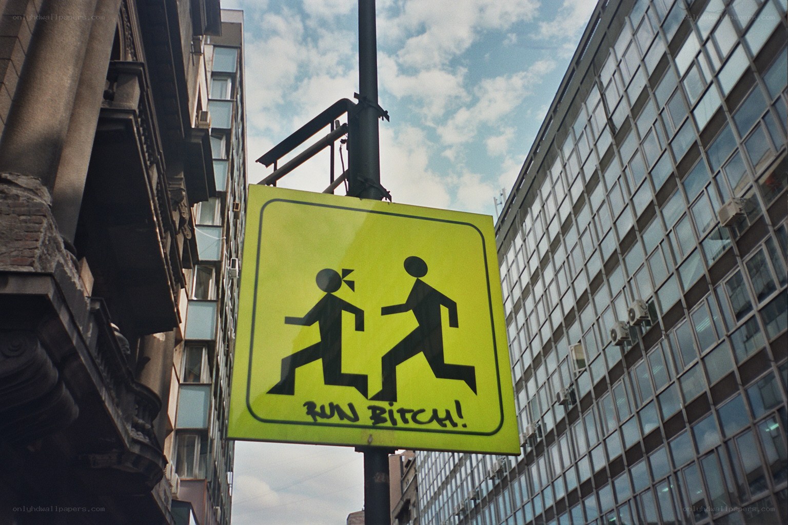 Graffiti on pedestrian sign