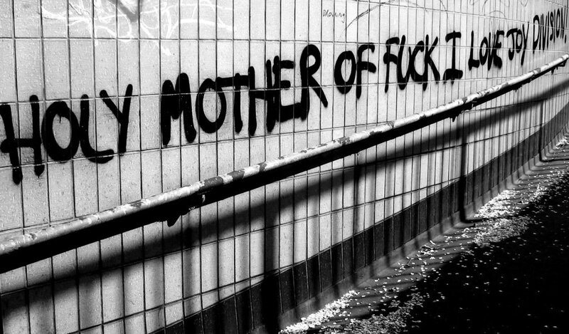 Graffiti on tiled wall