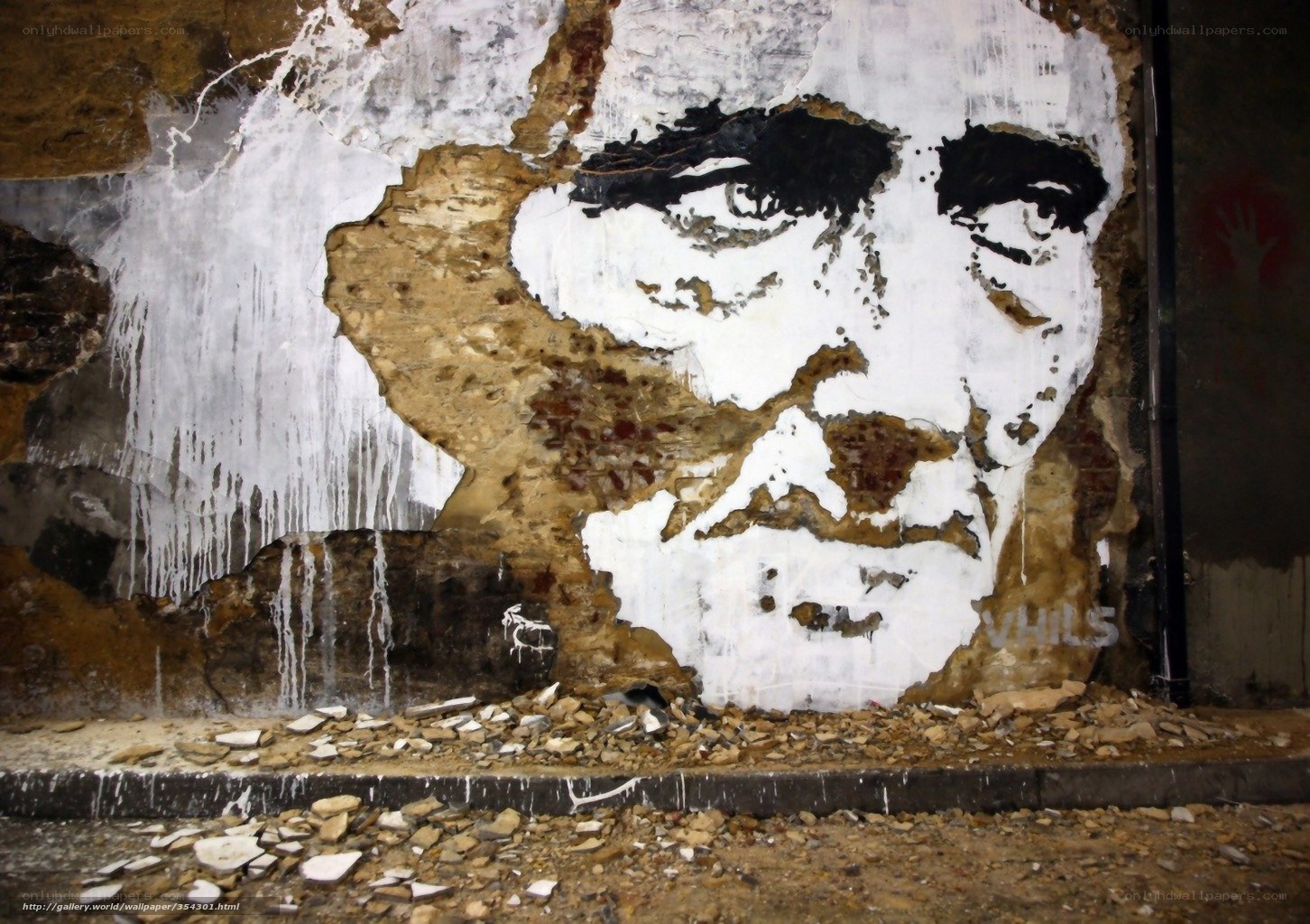 graffiti portrait on damaged wall
