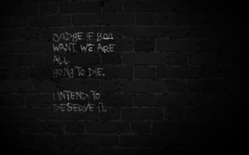 graffiti quote on brick wall