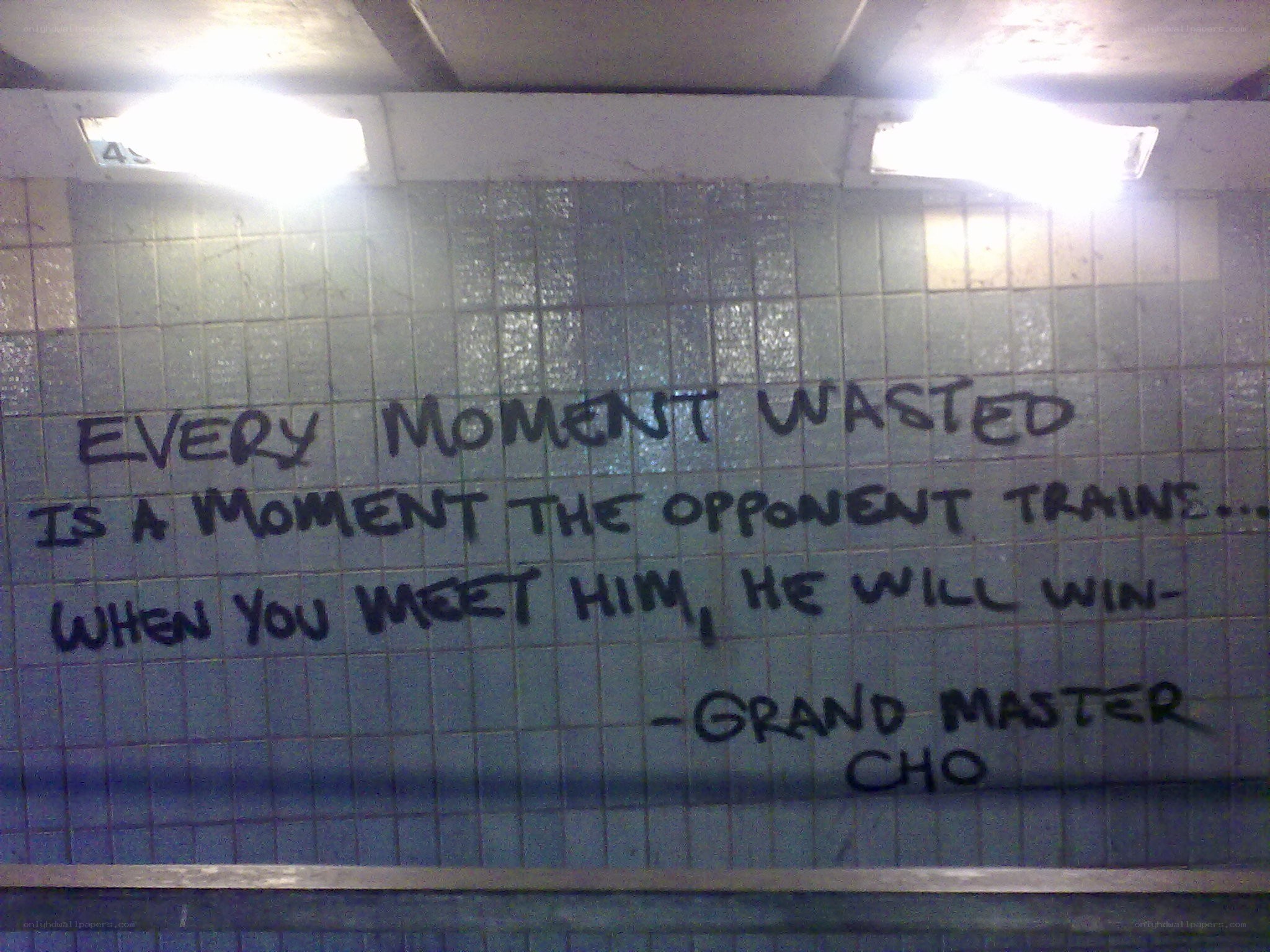 graffiti quote on tiled wall